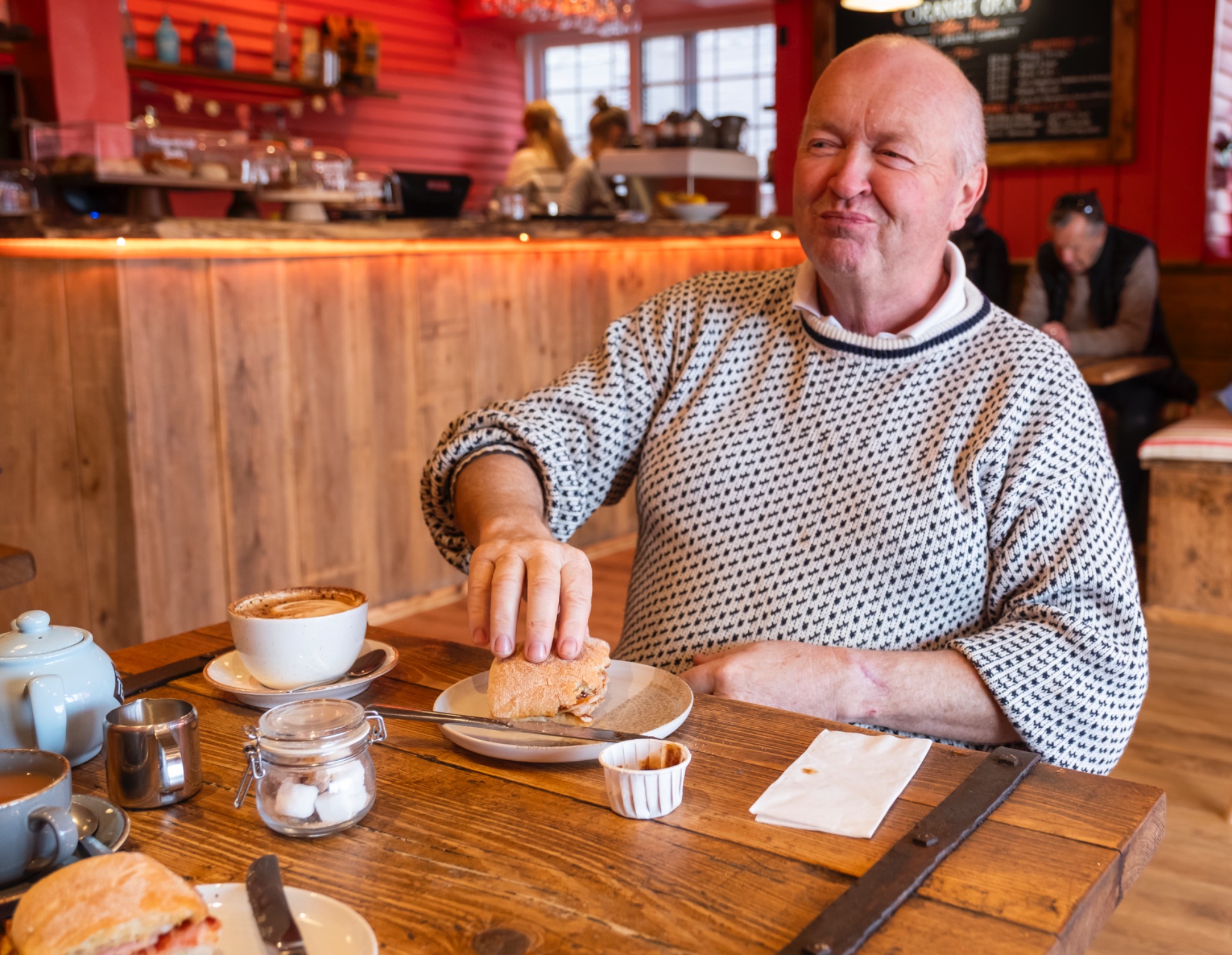 Customer enjoying coffee and cake